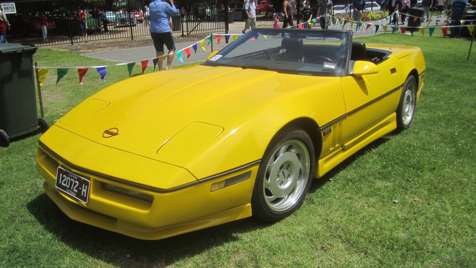 1987 Chevrolet Corvette, C4 fourth generation — yellow convertible, front three-quarter view