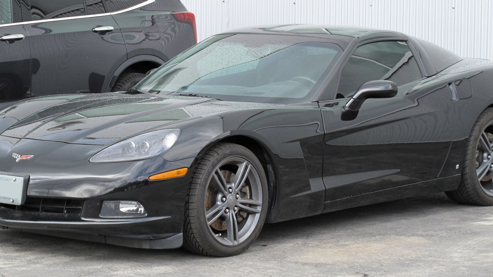 2008 Chevrolet Corvette — C6 black coupe, front three-quarter view