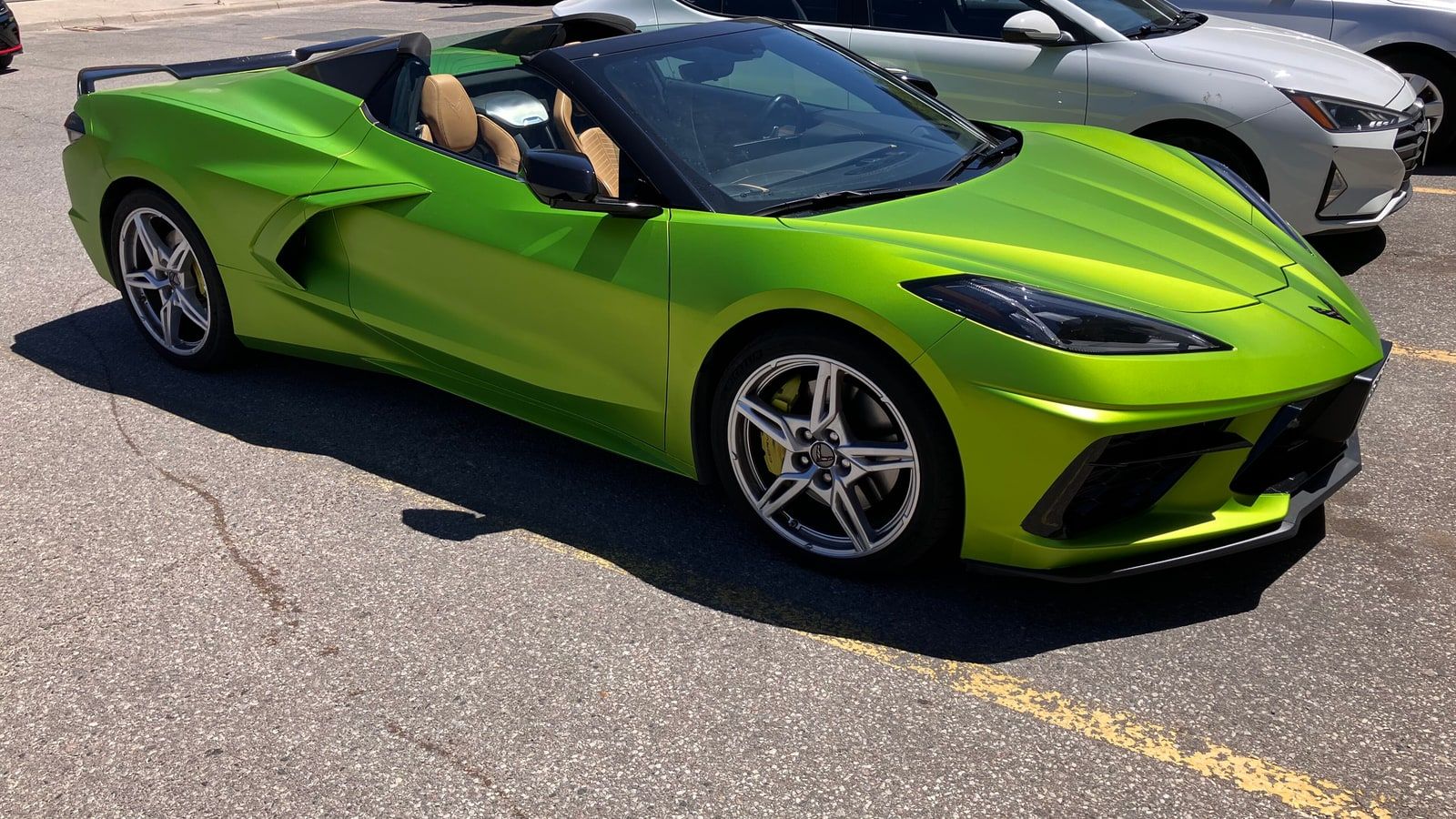 2026 Chevrolet Corvette — C8 coupe in lime green, front three-quarter view