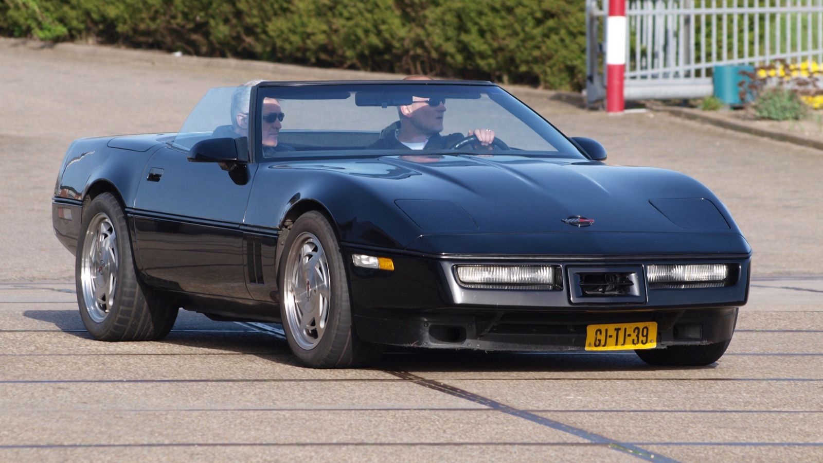1987 Chevrolet Corvette, C4 fourth generation — black convertible, front three-quarter view