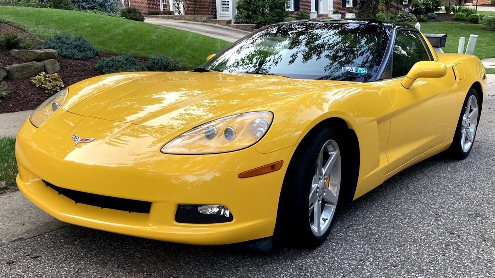 Chevrolet Corvette C6, sixth generation — yellow coupe, front three-quarter view