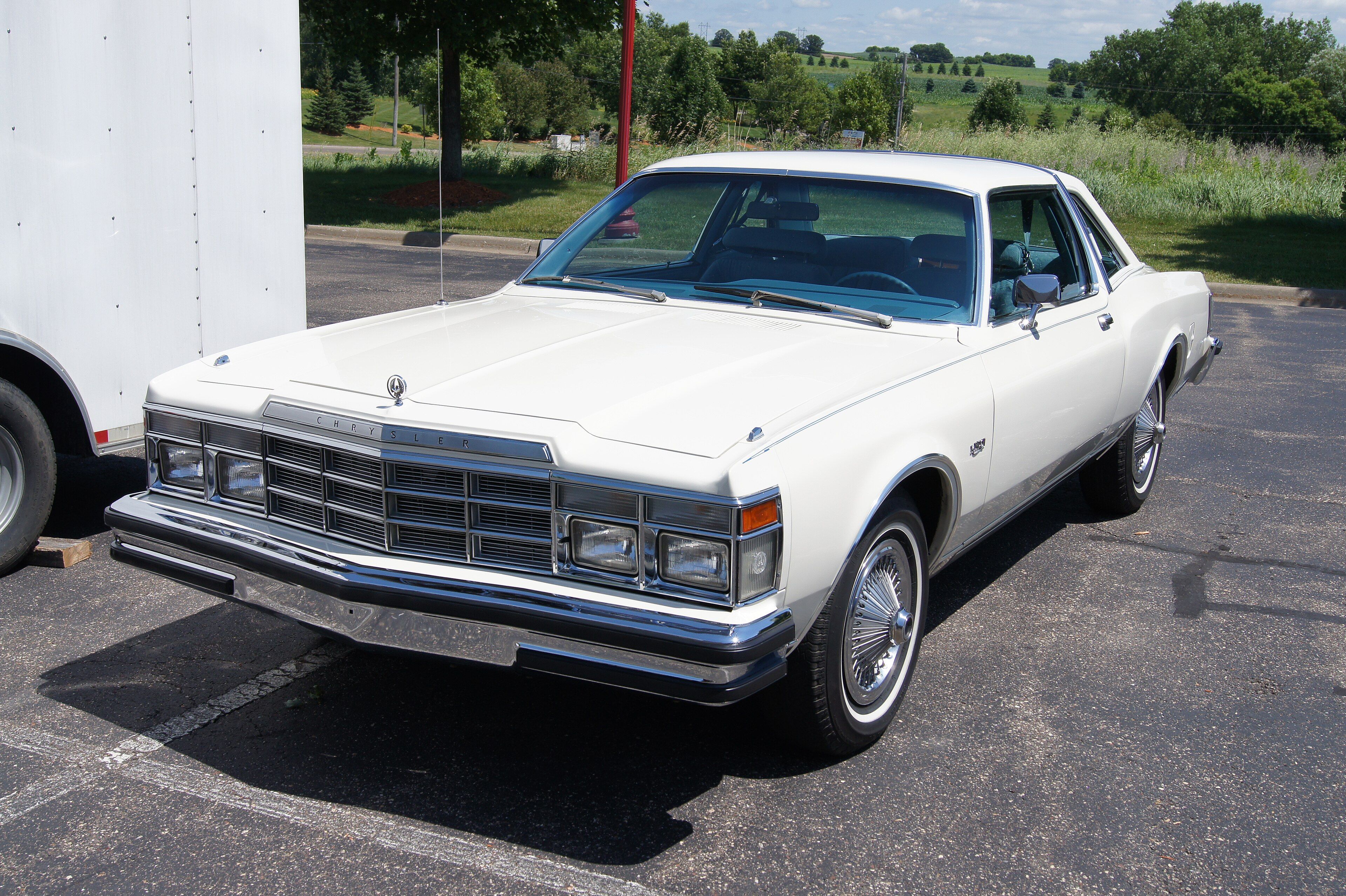 Cream 1977 Chrysler LeBaron two-door coupe, front three-quarter view