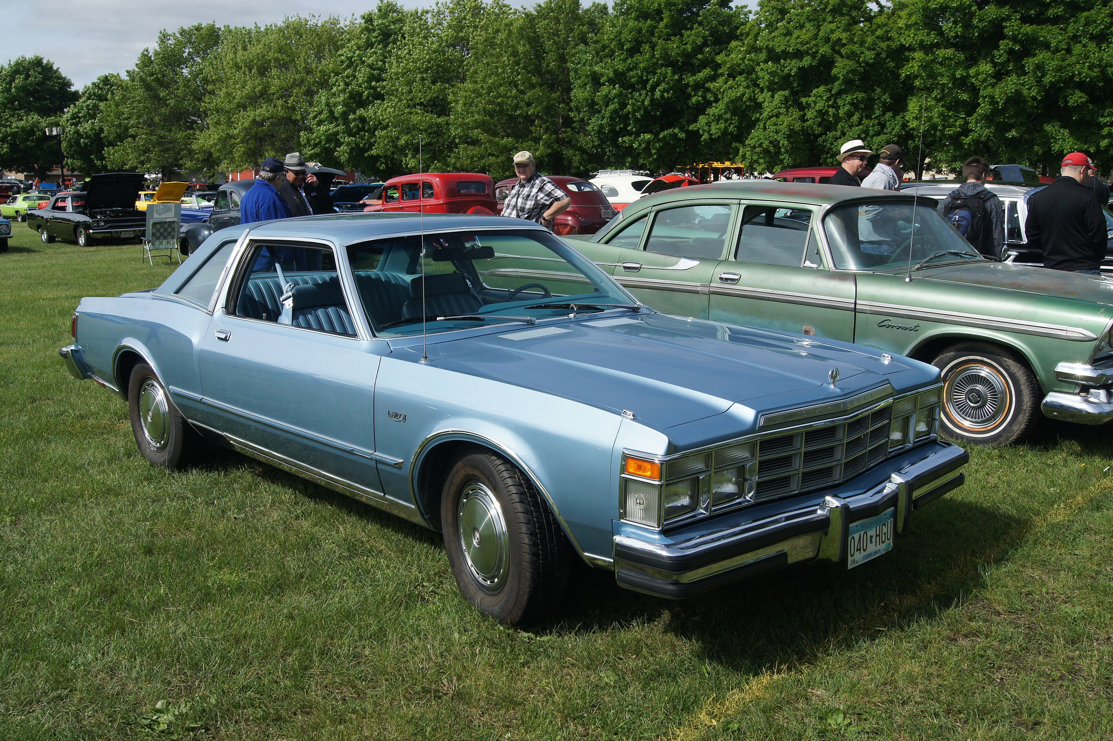 Light blue 1978 Chrysler LeBaron two-door coupe at a car show, front three-quarter view