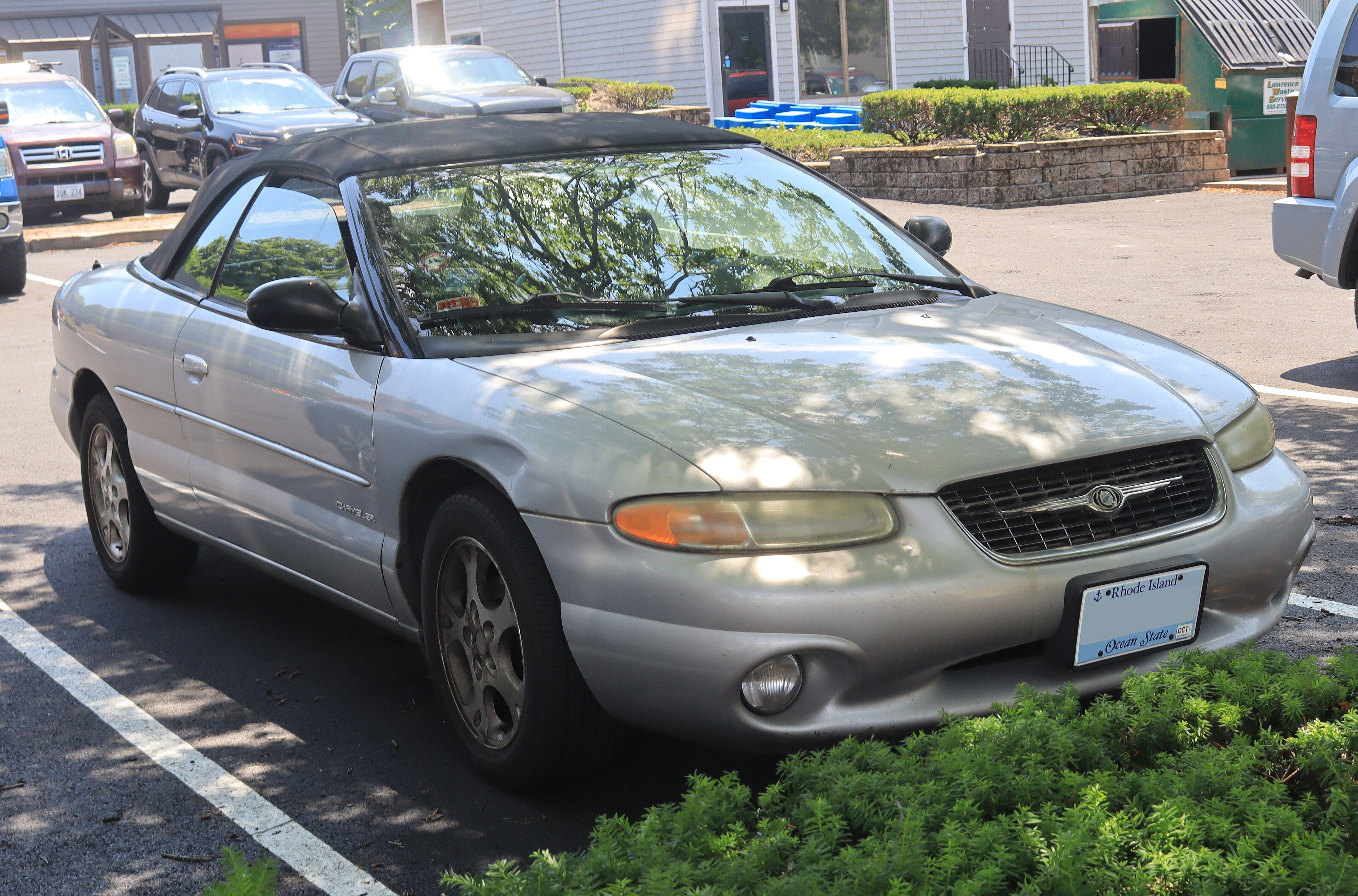 Silver 2000 Chrysler Sebring JXi Limited convertible with the top up, front three-quarter view