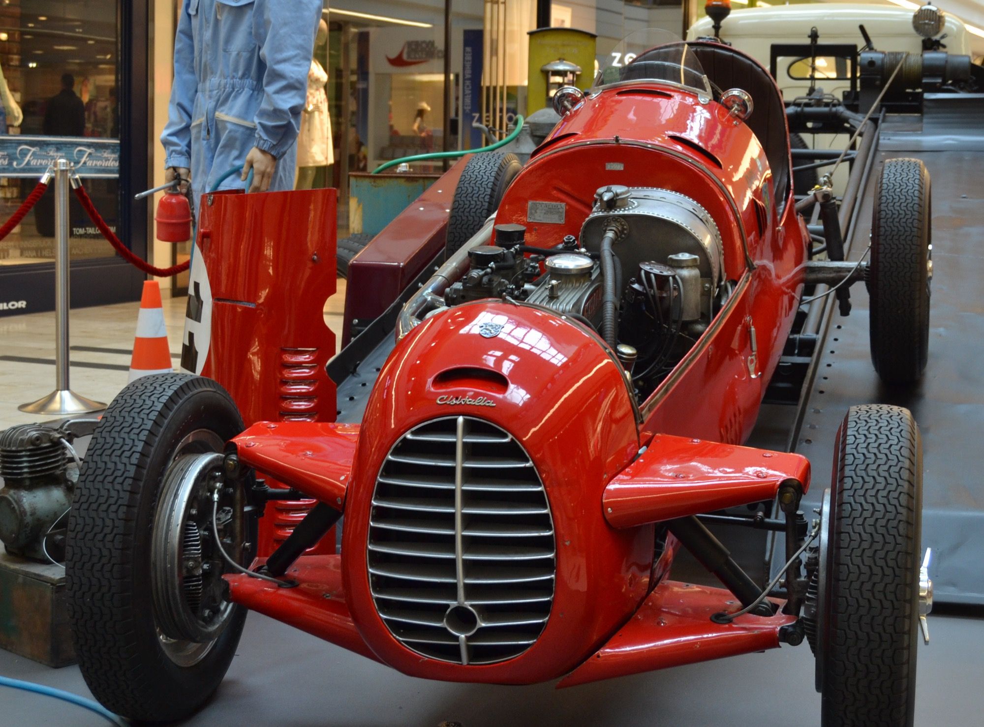 Red Cisitalia D46 monoposto, front view with bodywork removed on the left flank