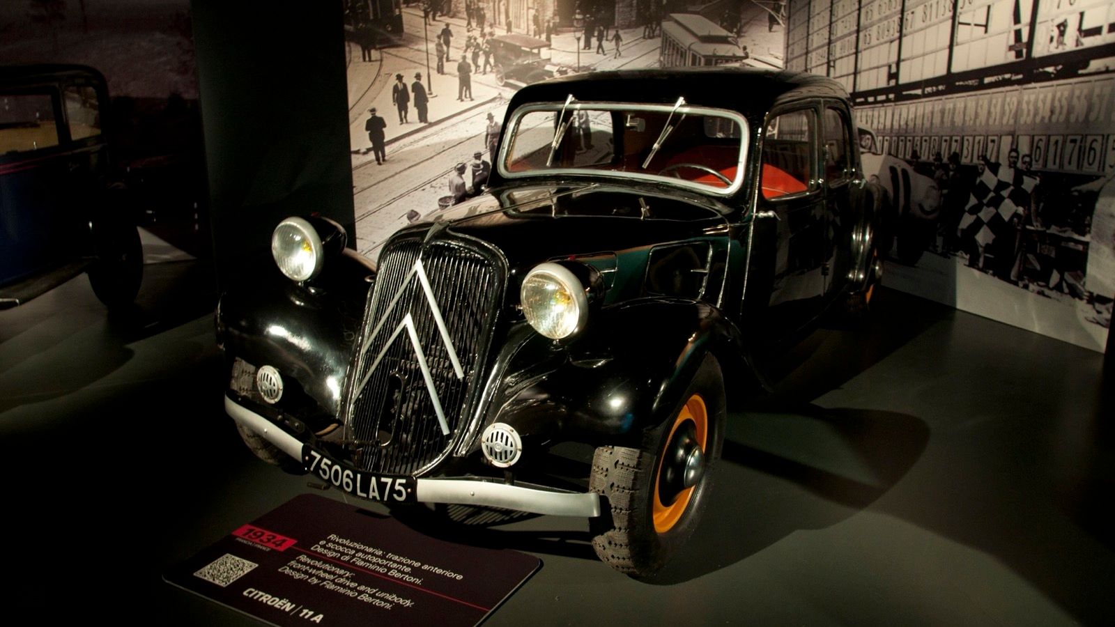 Black 1934 Citroën Traction Avant 11 A on museum display, front three-quarter view