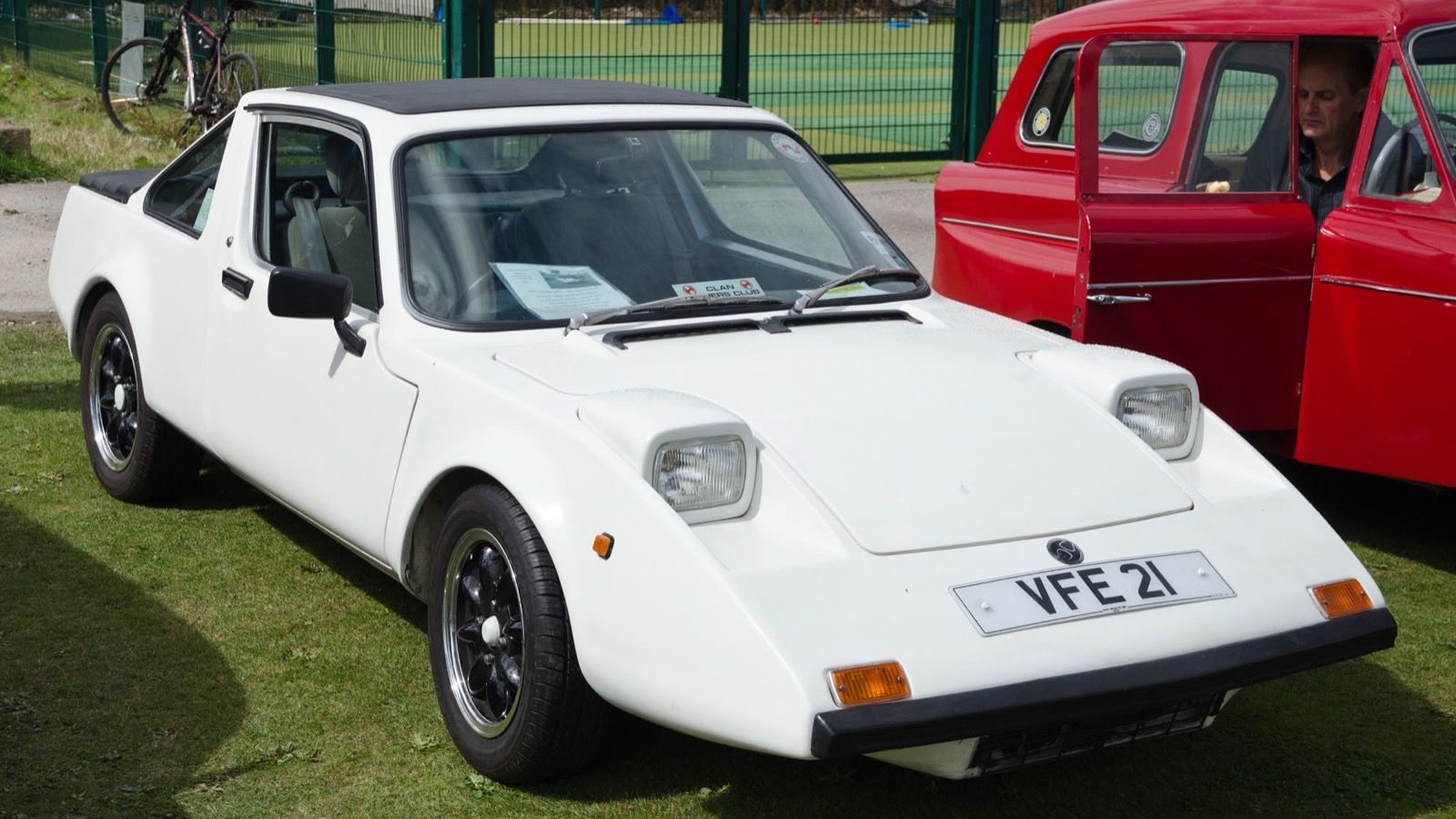 White 1971 Clan Crusader coupé at a classic car show, front three-quarter view