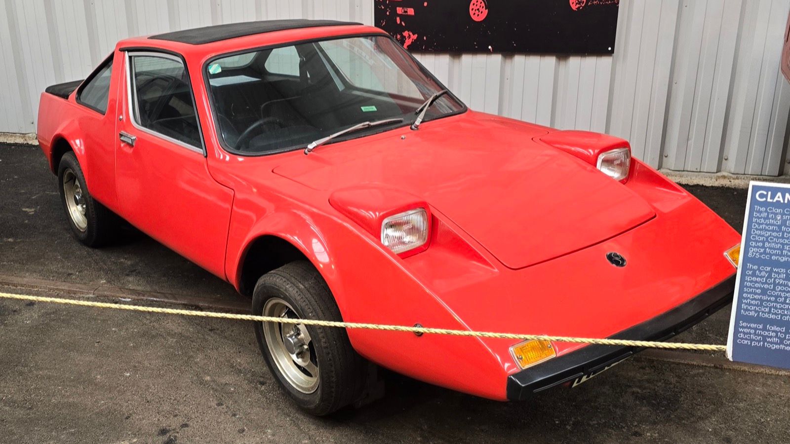 Red Clan Crusader coupé on museum display, front three-quarter view
