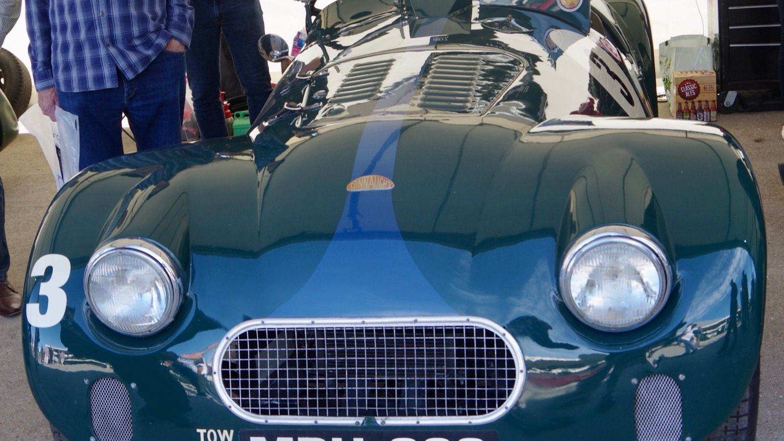 Front view of a British racing green Connaught L2 sports car, showing the oval mesh grille and Connaught badge.