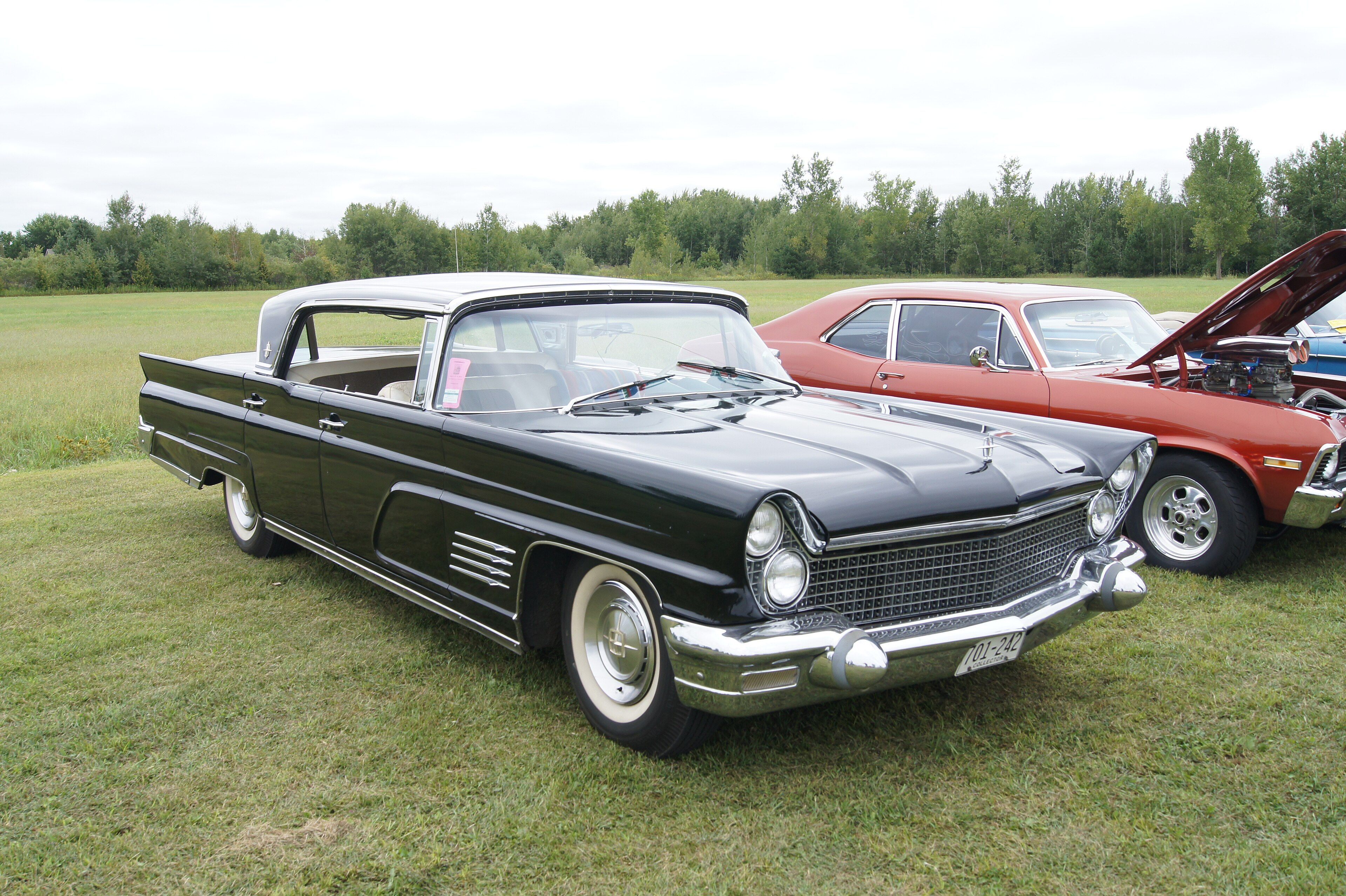 Black 1960 Continental Mark V hardtop coupe, front three-quarter view