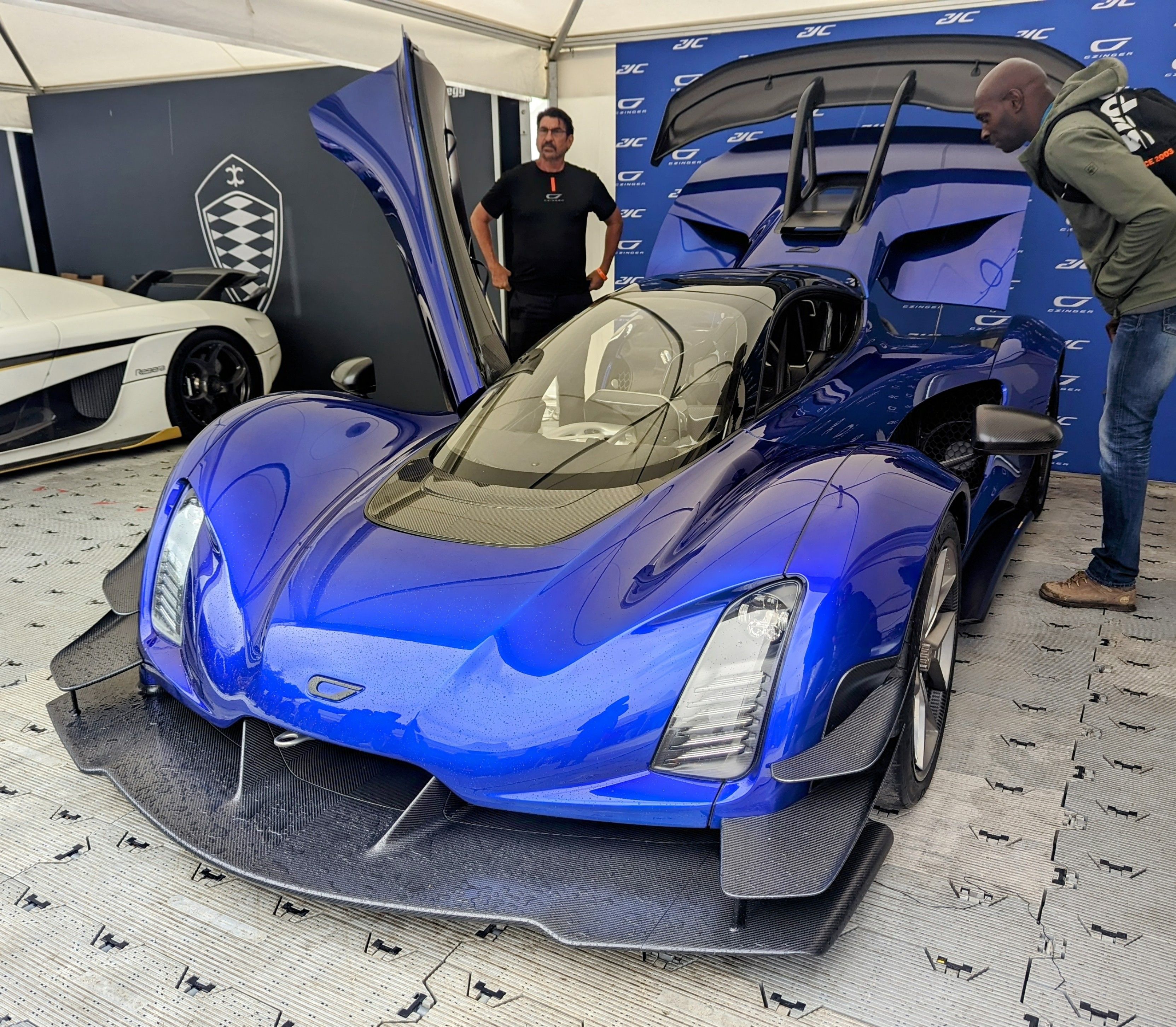 Blue Czinger 21C hypercar with door raised, front three-quarter view