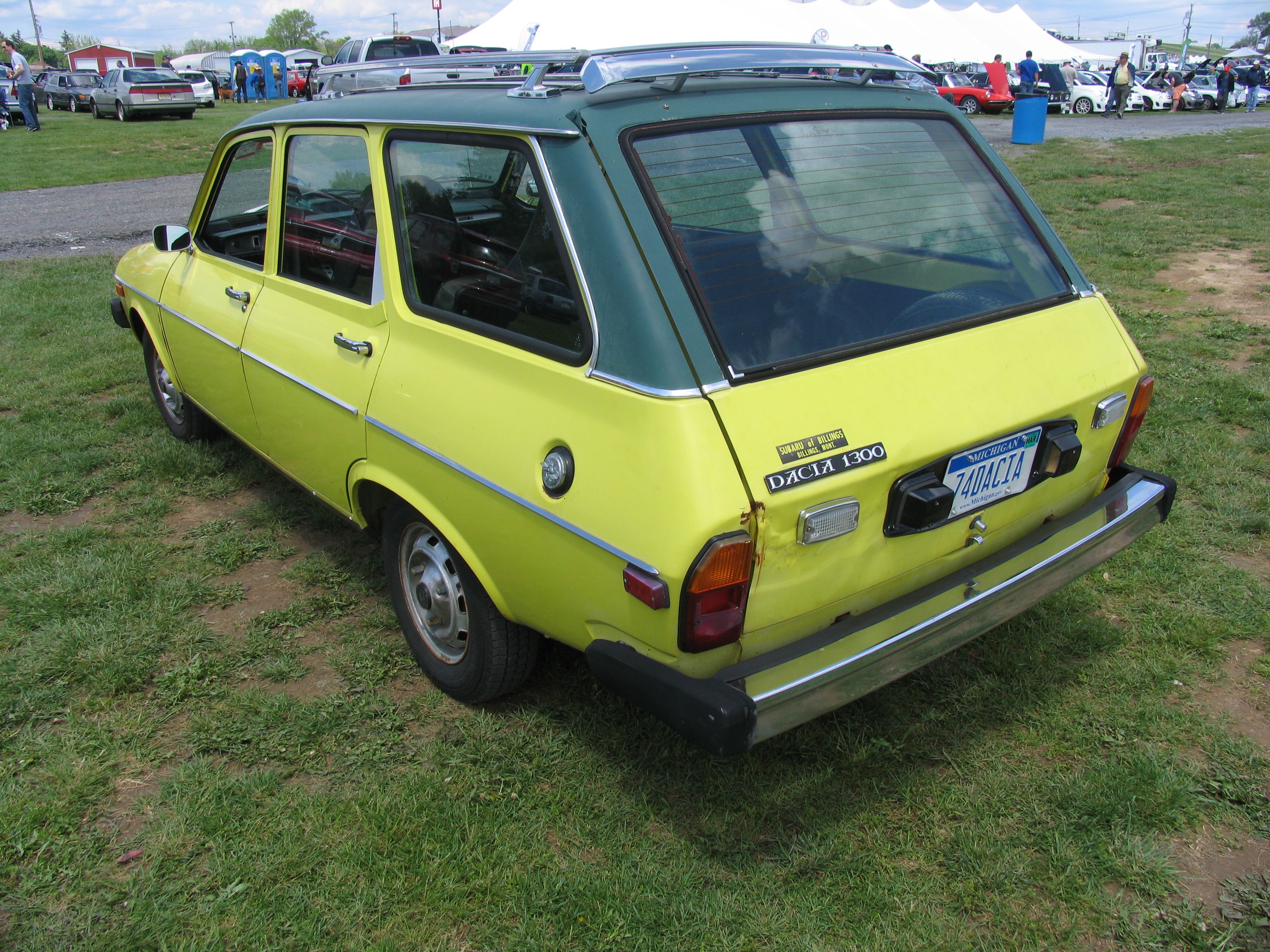 Yellow Dacia 1300 estate, rear three-quarter view