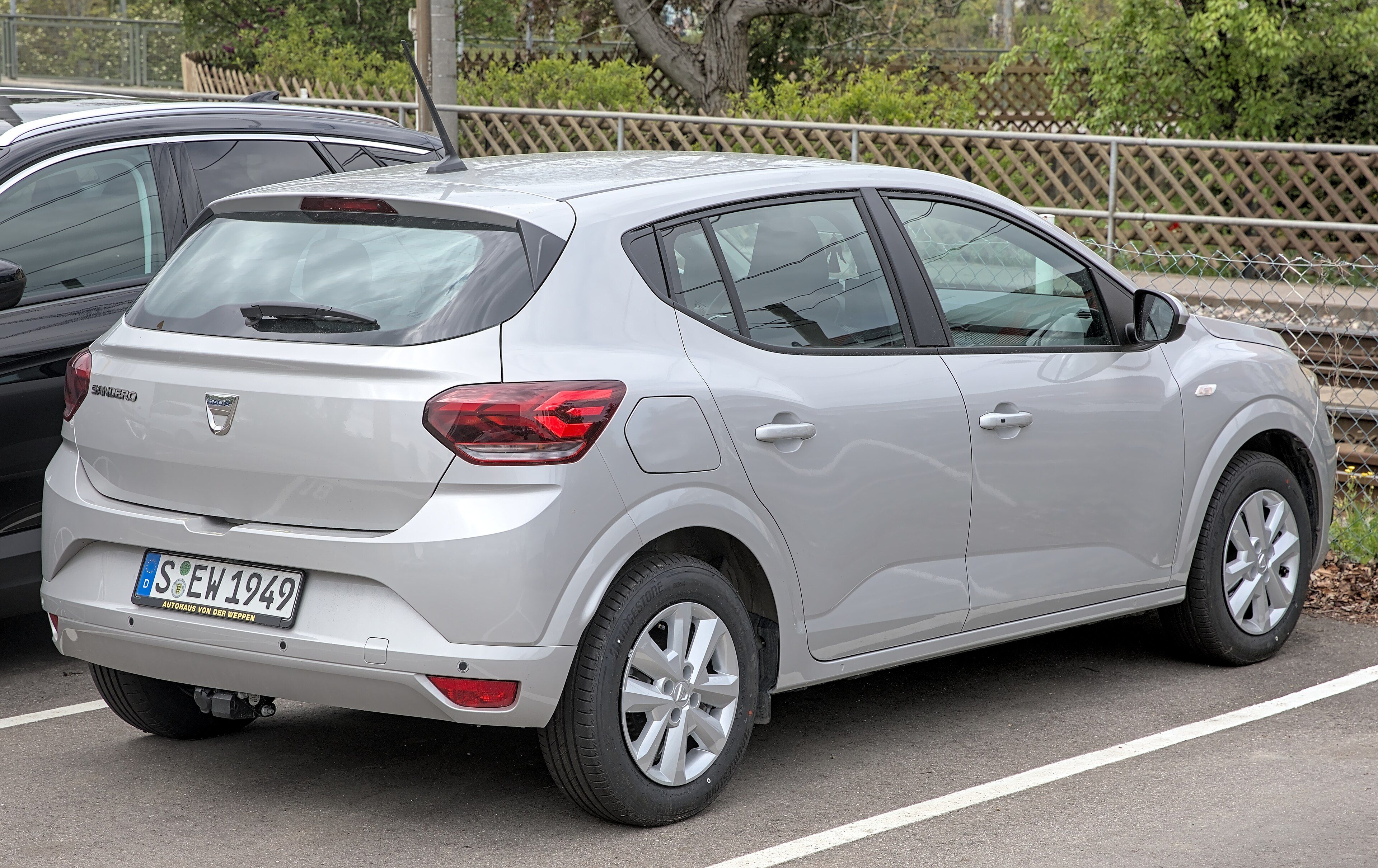 Silver third-generation Dacia Sandero hatchback, rear three-quarter view