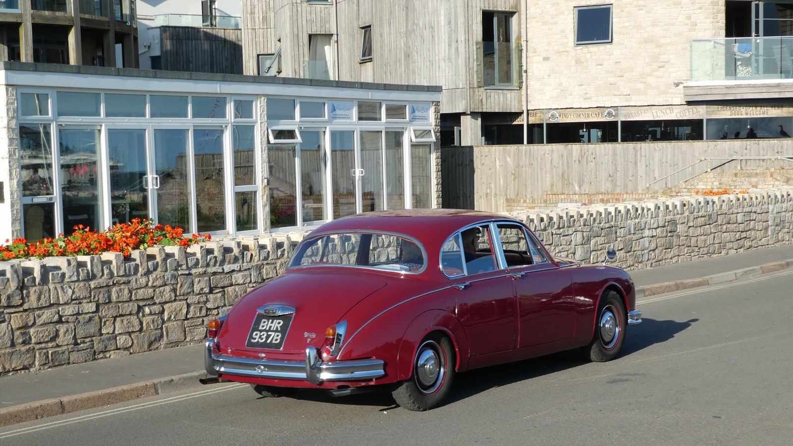 Red 1964 Daimler 2½-litre V8 saloon, rear three-quarter view