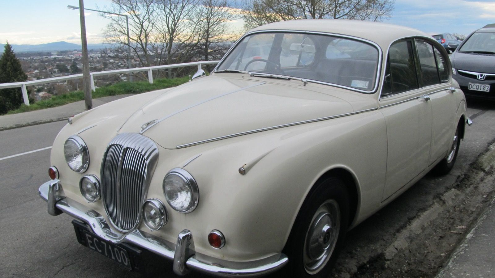 Cream 1969 Daimler V8-250 saloon with slim bumpers, front three-quarter view