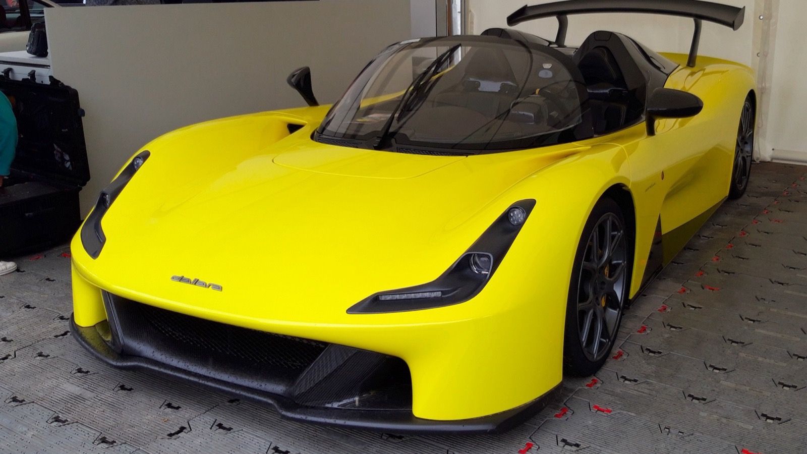 Yellow 2019 Dallara Stradale with tall rear wing, front three-quarter view