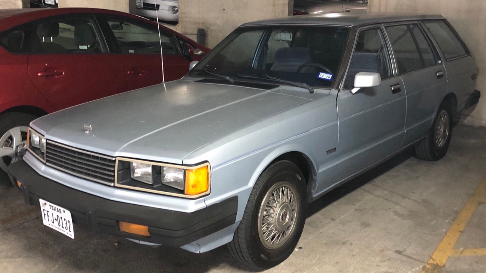 Light blue Datsun 810 Maxima diesel station wagon, front three-quarter view