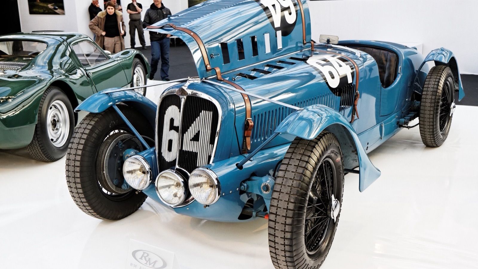 Blue 1936 Delahaye 135 S competition roadster with bonnet raised, front three-quarter view