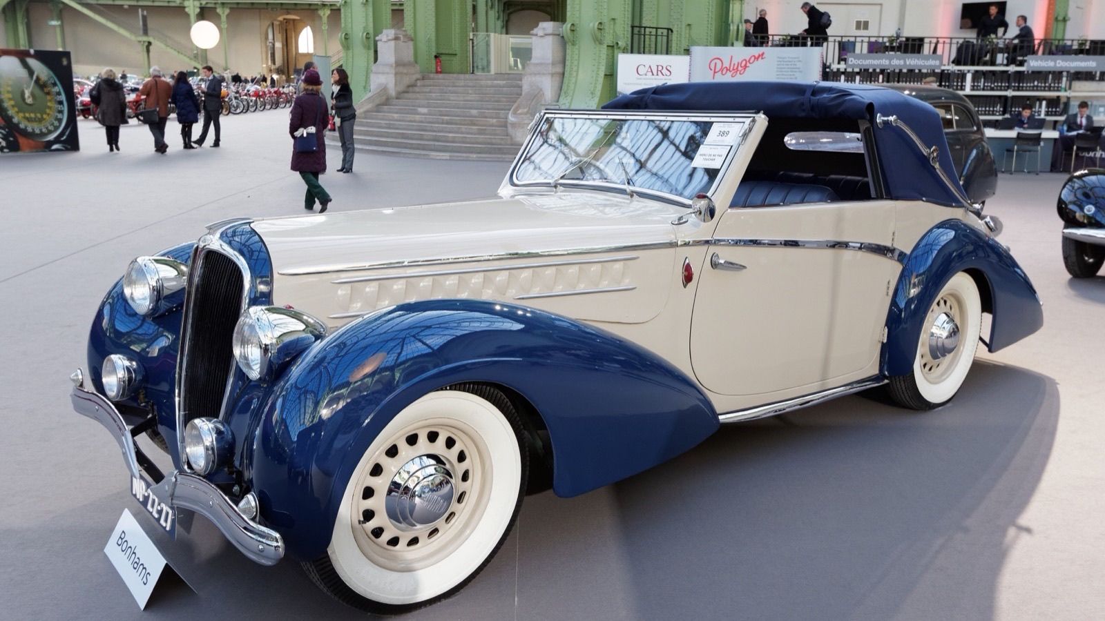 Blue and cream 1946 Delahaye 135M cabriolet at auction, front three-quarter view