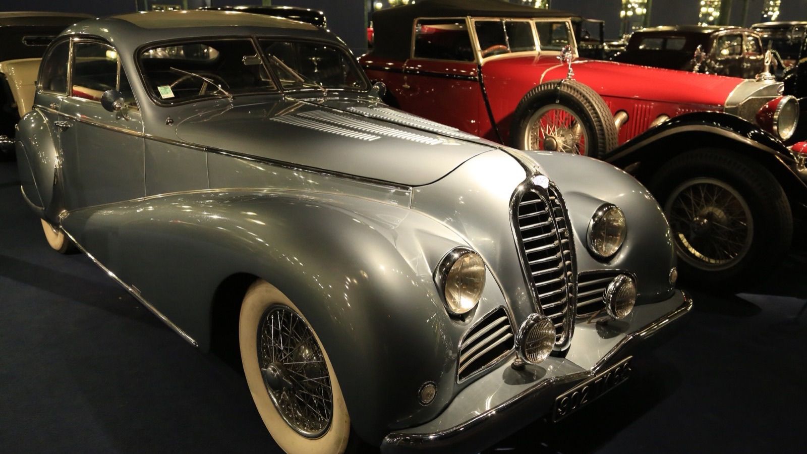 Silver-grey 1949 Delahaye 135M Coach Profilée by Antem at the Mulhouse museum, front three-quarter view