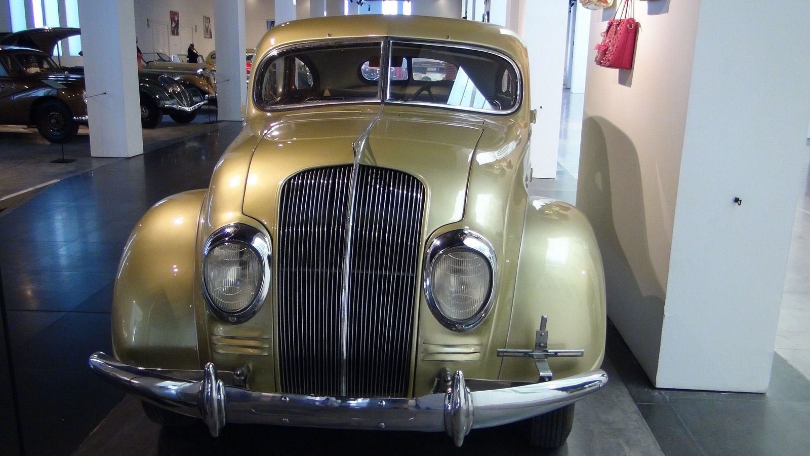 Gold 1934 DeSoto Airflow on museum display, front view