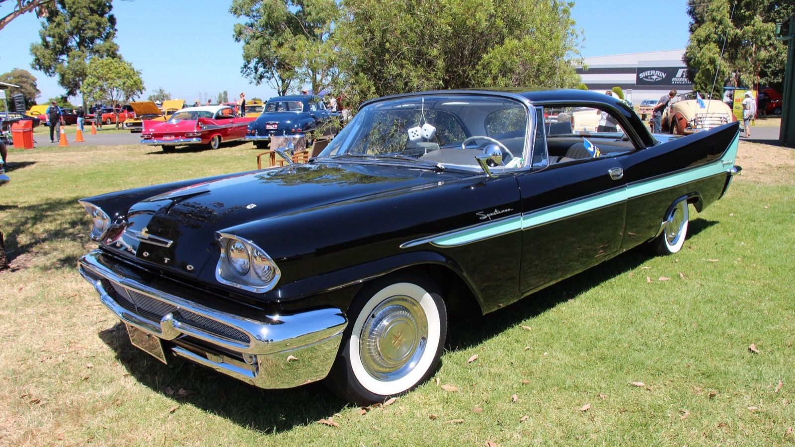 Black and turquoise 1958 DeSoto Firedome Sportsman hardtop, front three-quarter view