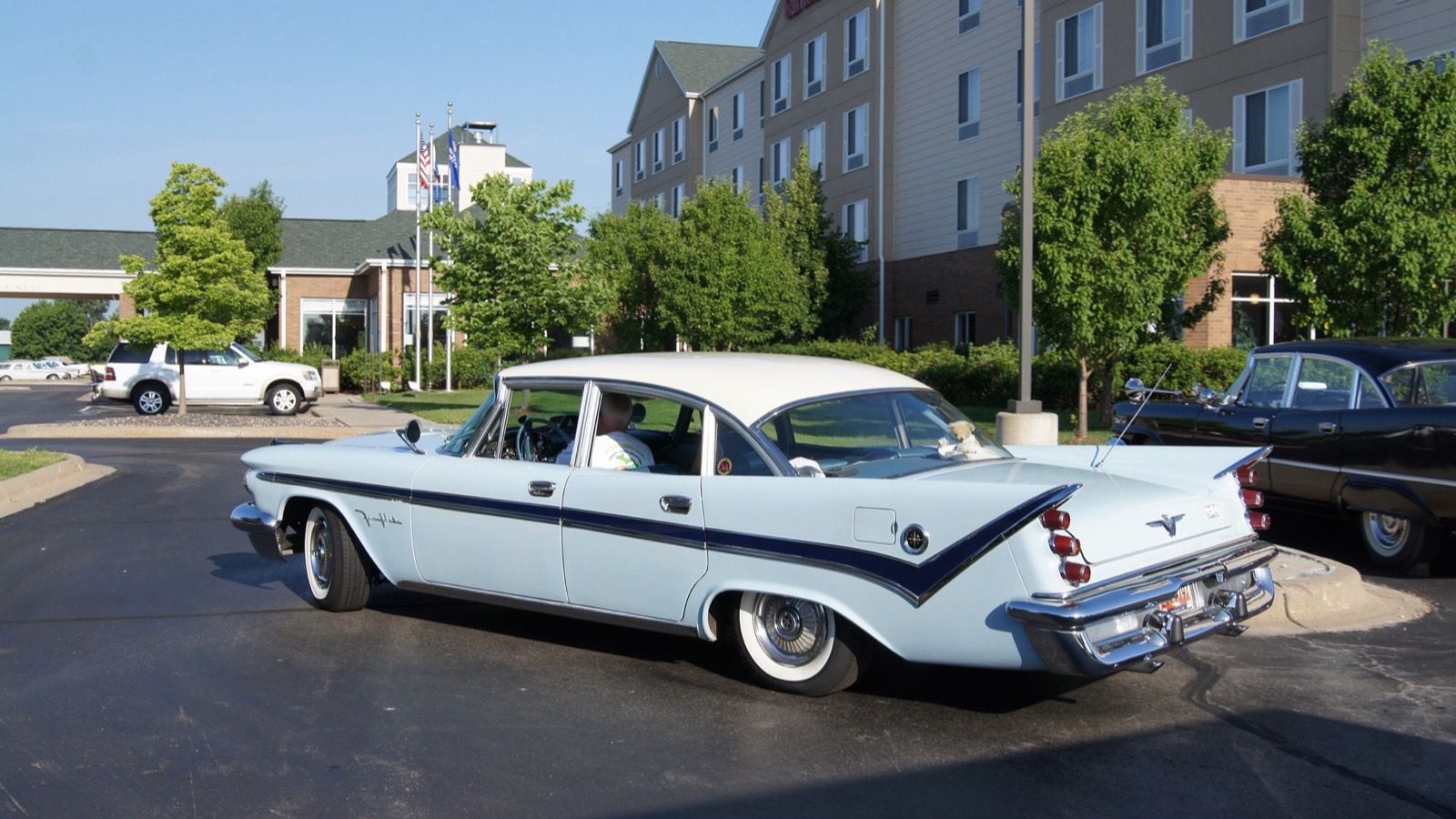 Light blue 1959 DeSoto Fireflite four-door sedan, rear three-quarter view