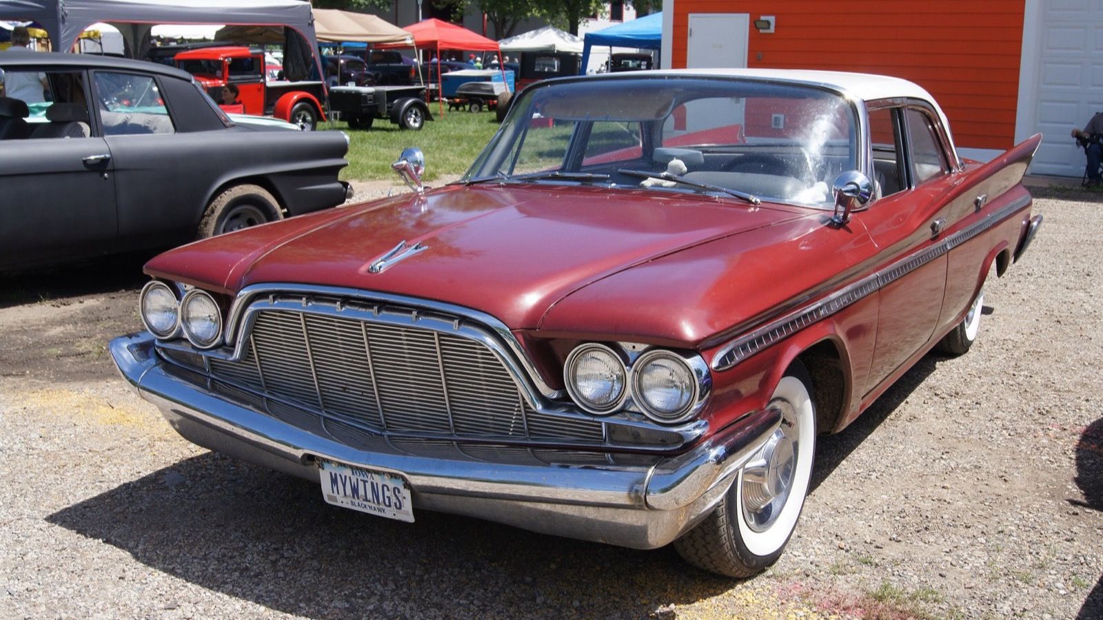 Maroon 1960 DeSoto Fireflite sedan with white roof, front three-quarter view
