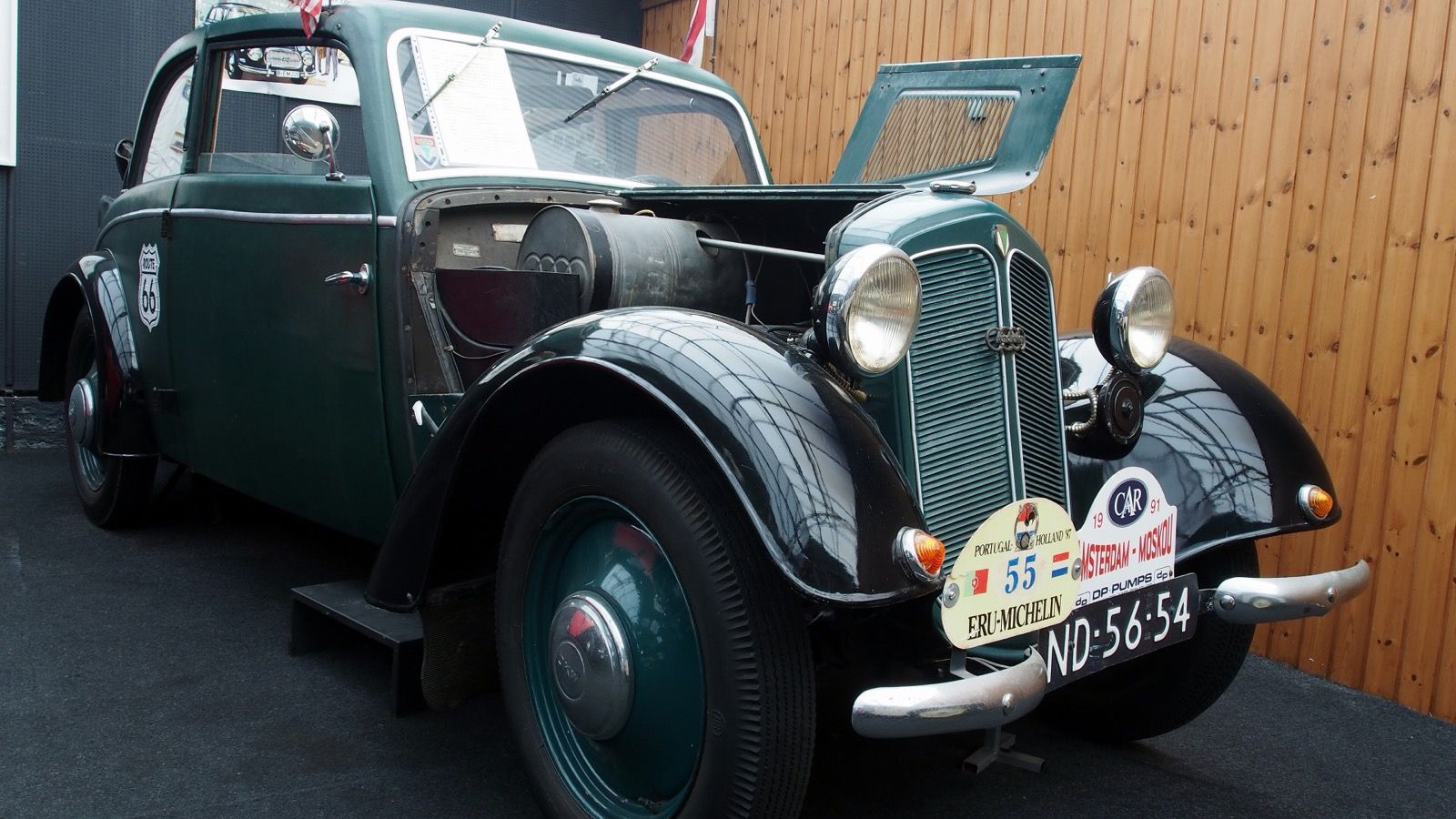 Dark green 1937 DKW F7 Reichsklasse on museum display with bonnet raised, front three-quarter view