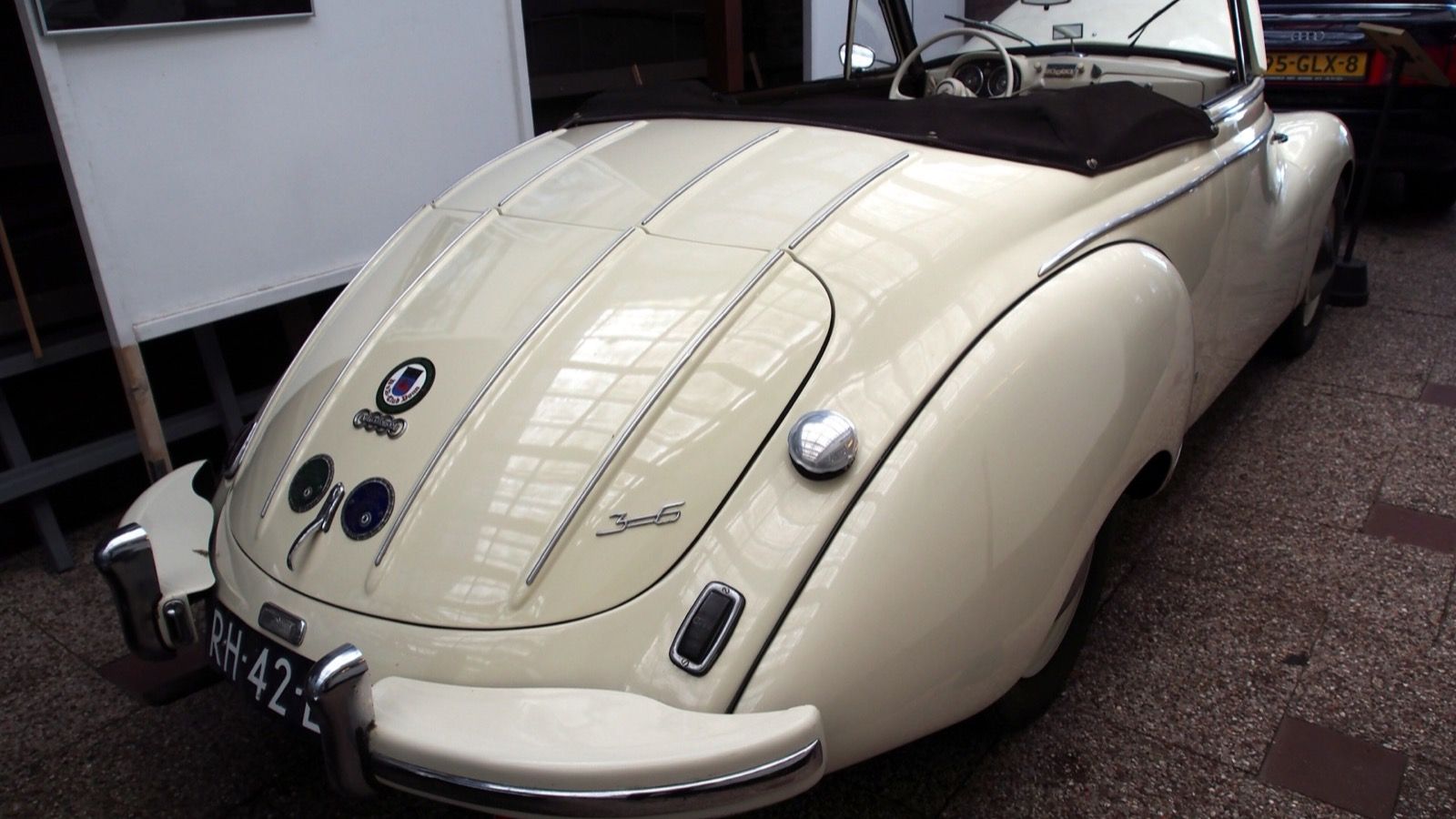 Cream 1954 DKW F91 Sonderklasse Karmann cabriolet indoors, rear three-quarter view