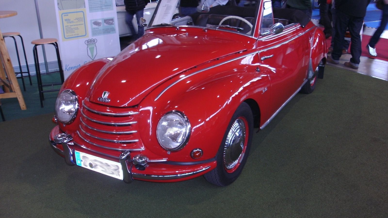Red 1955 DKW F91 Sonderklasse Cabriolet on indoor display, front three-quarter view