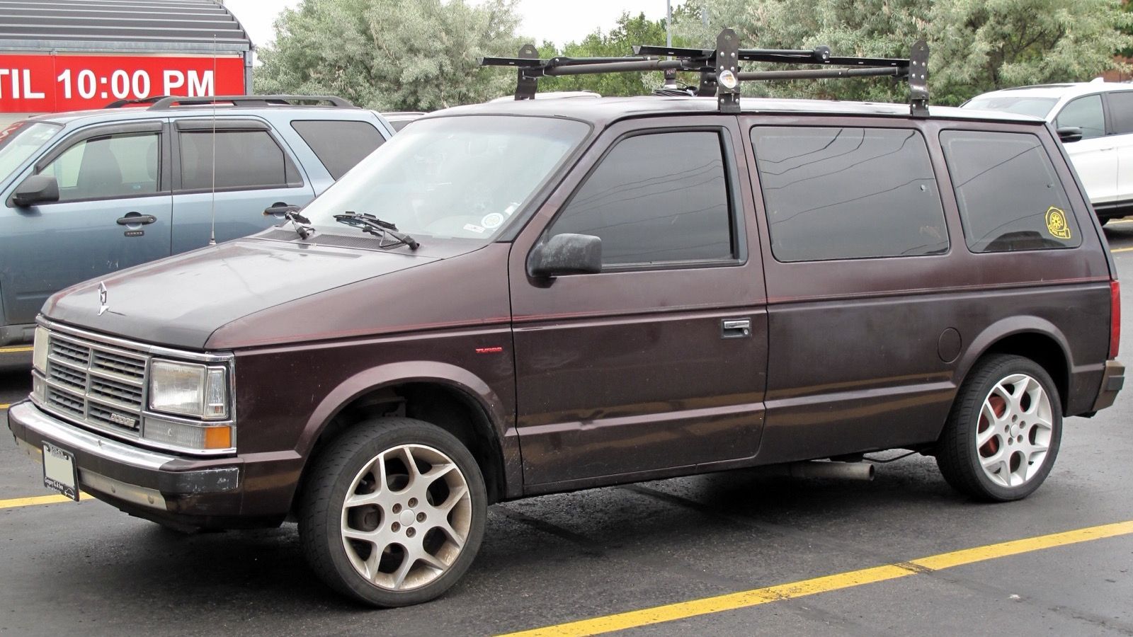Dark red 1989 Dodge Caravan SE Turbo minivan, front three-quarter view