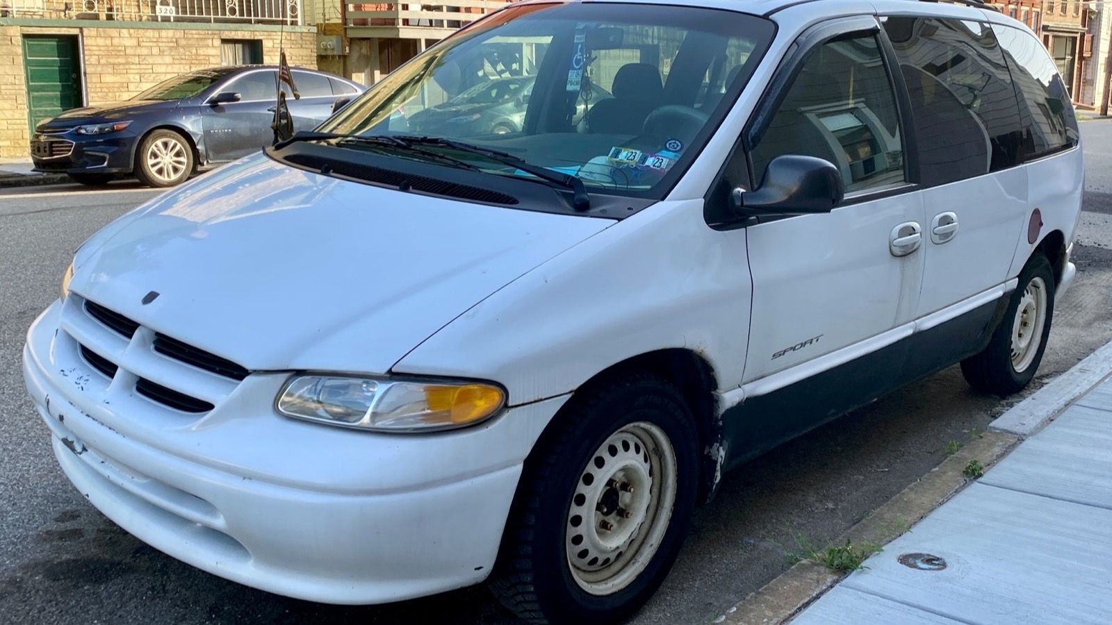 White 2000 Dodge Caravan Sport minivan, front three-quarter view