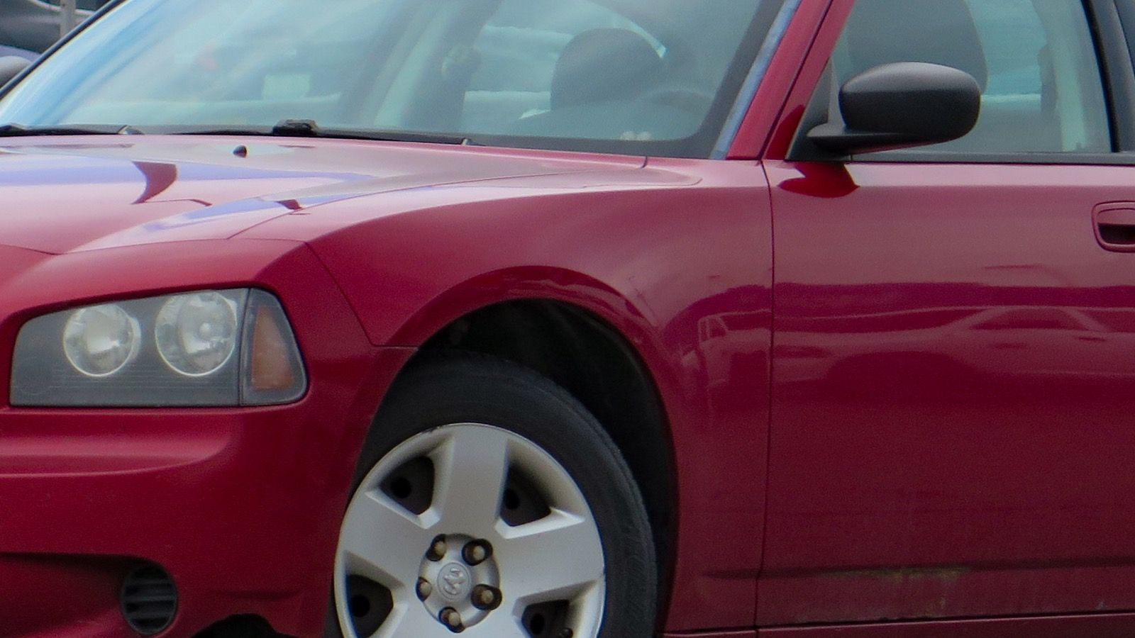 2008 Dodge Charger SE in Inferno Red — LX four-door sedan, front left view
