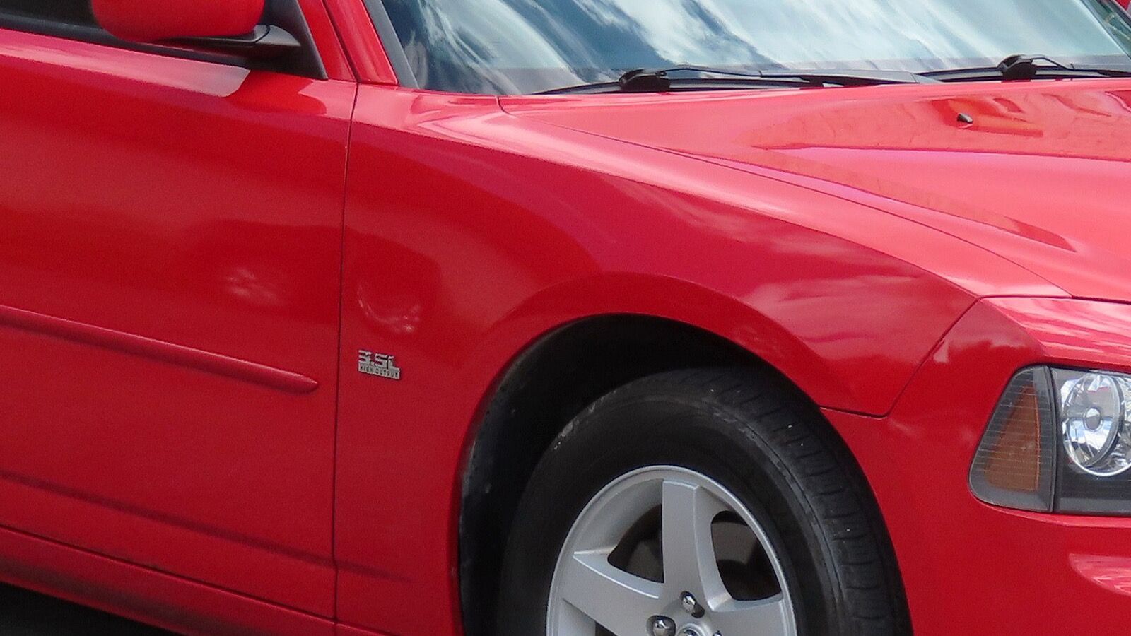 2010 Dodge Charger 3.5L — LX four-door sedan, front right view