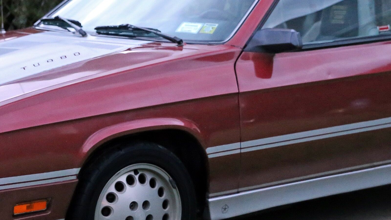 Fifth-generation Dodge Charger — 1987 Shelby Charger L-body hatchback, front left view