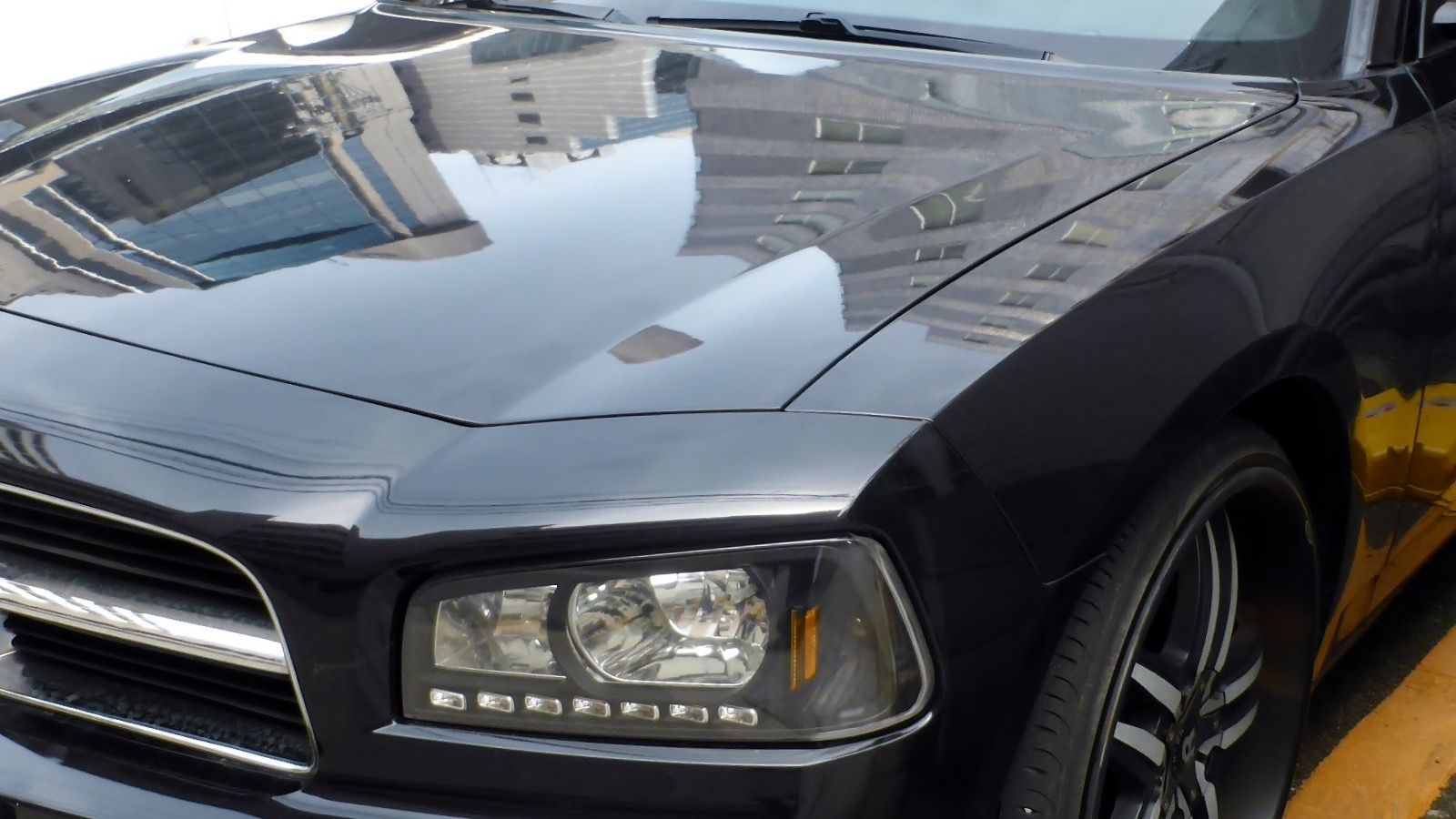 Sixth-generation Dodge Charger — LX four-door sedan, front view