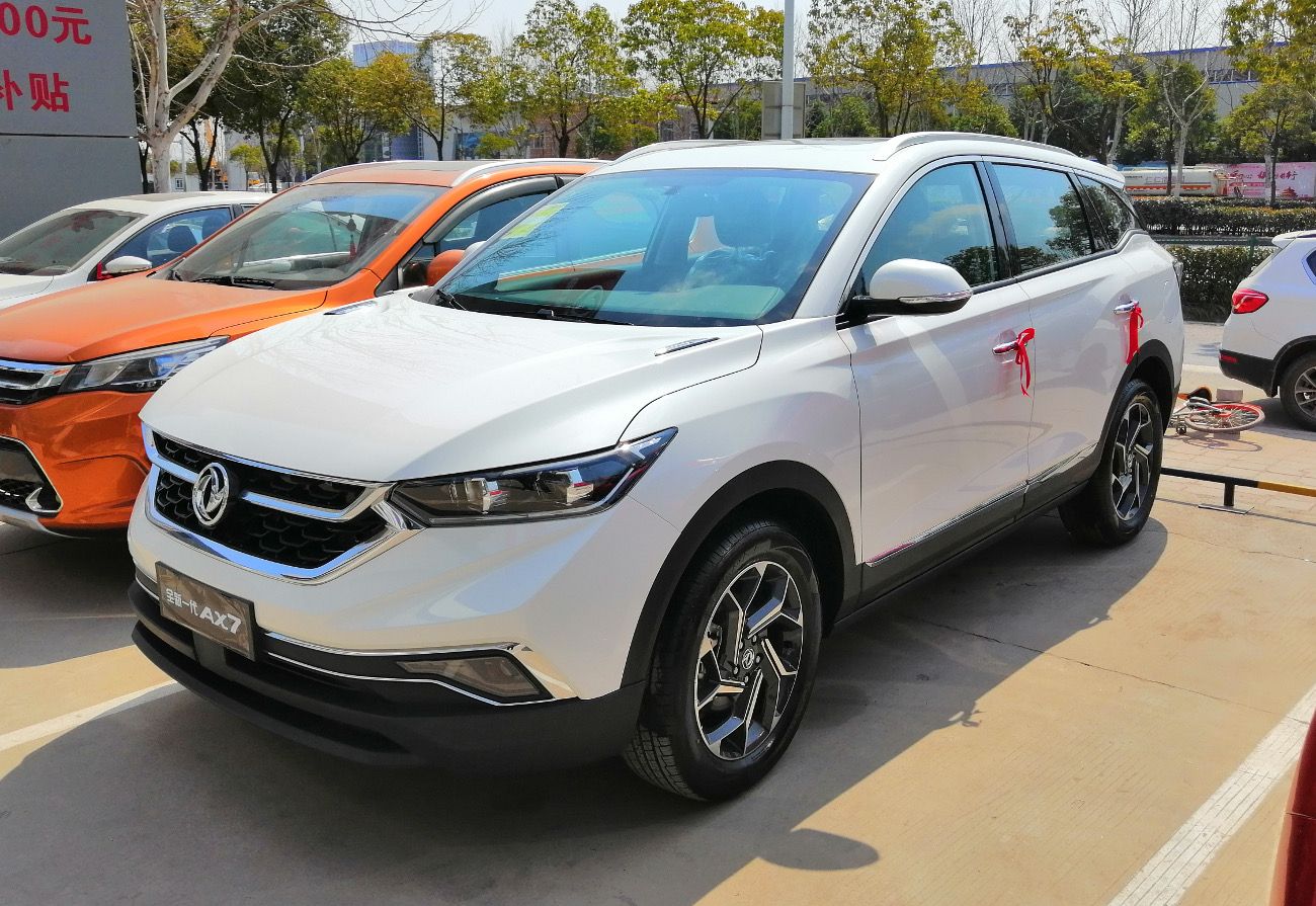 White second-generation Dongfeng Aeolus AX7 compact SUV, front three-quarter view