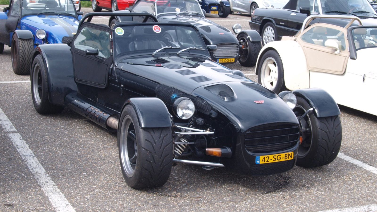 Black Donkervoort S8AT turbo roadster with louvred bonnet, front three-quarter view