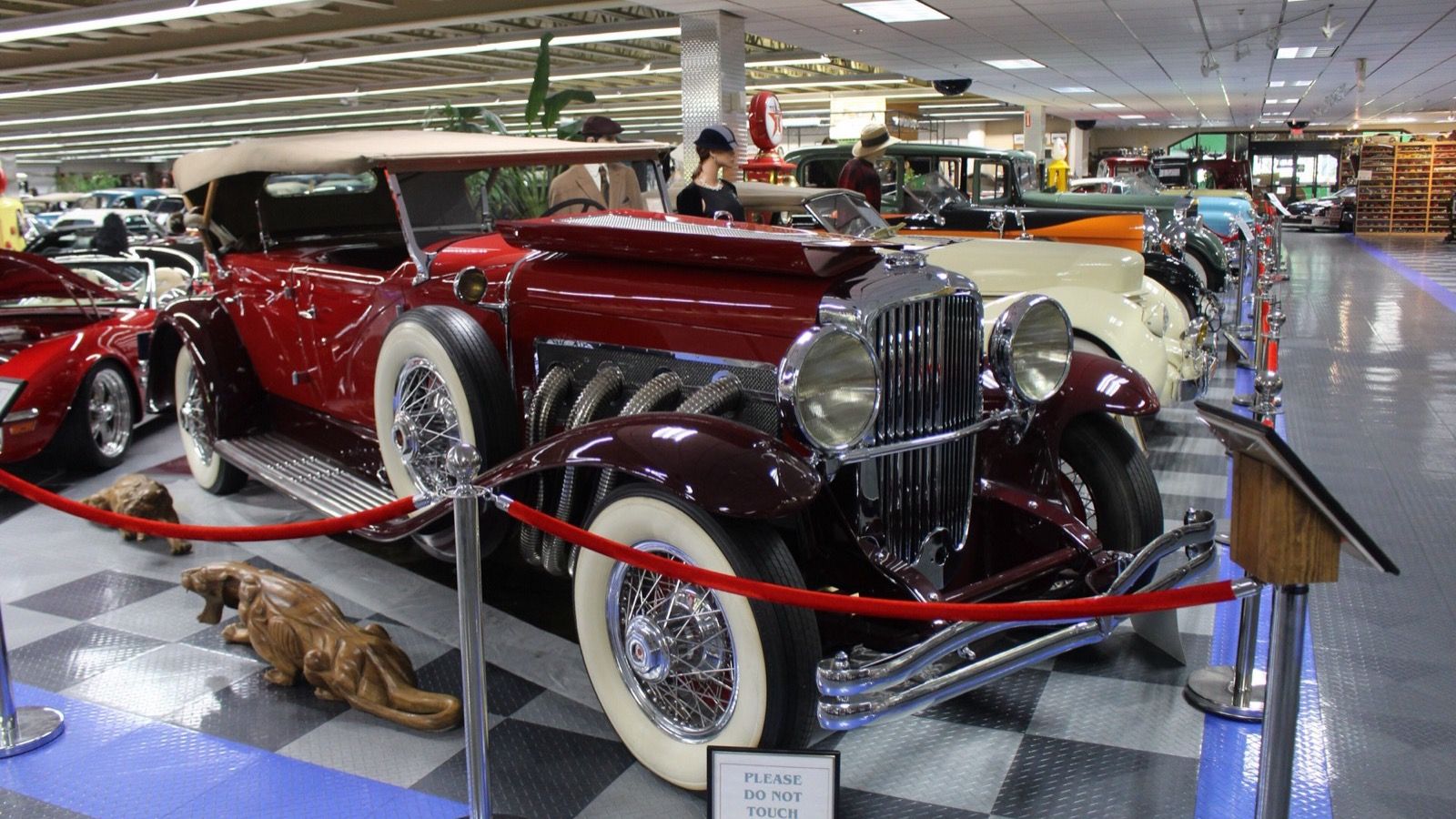 Maroon 1931 Duesenberg Model J dual-cowl phaeton, front-right three-quarter view