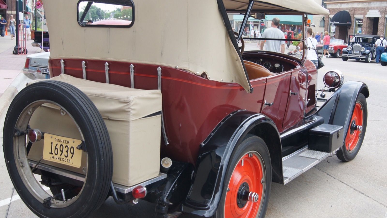 Maroon 1923 Durant A-22 touring car with rear-mounted spare wheel, rear three-quarter view