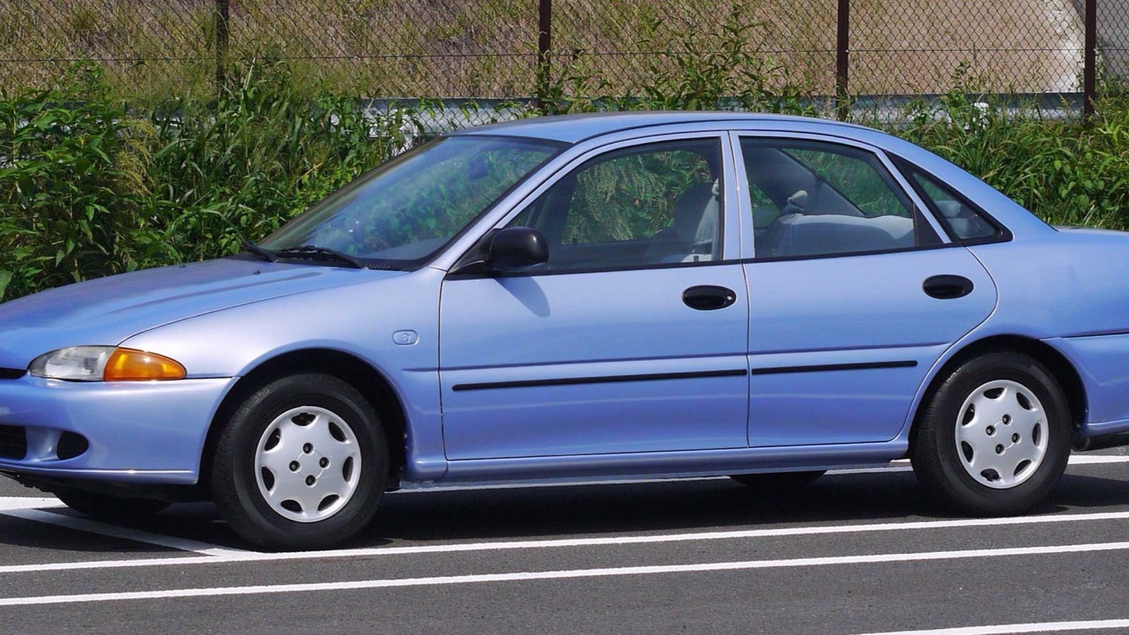 Light blue 1993 Eagle Summit four-door sedan, front three-quarter view.