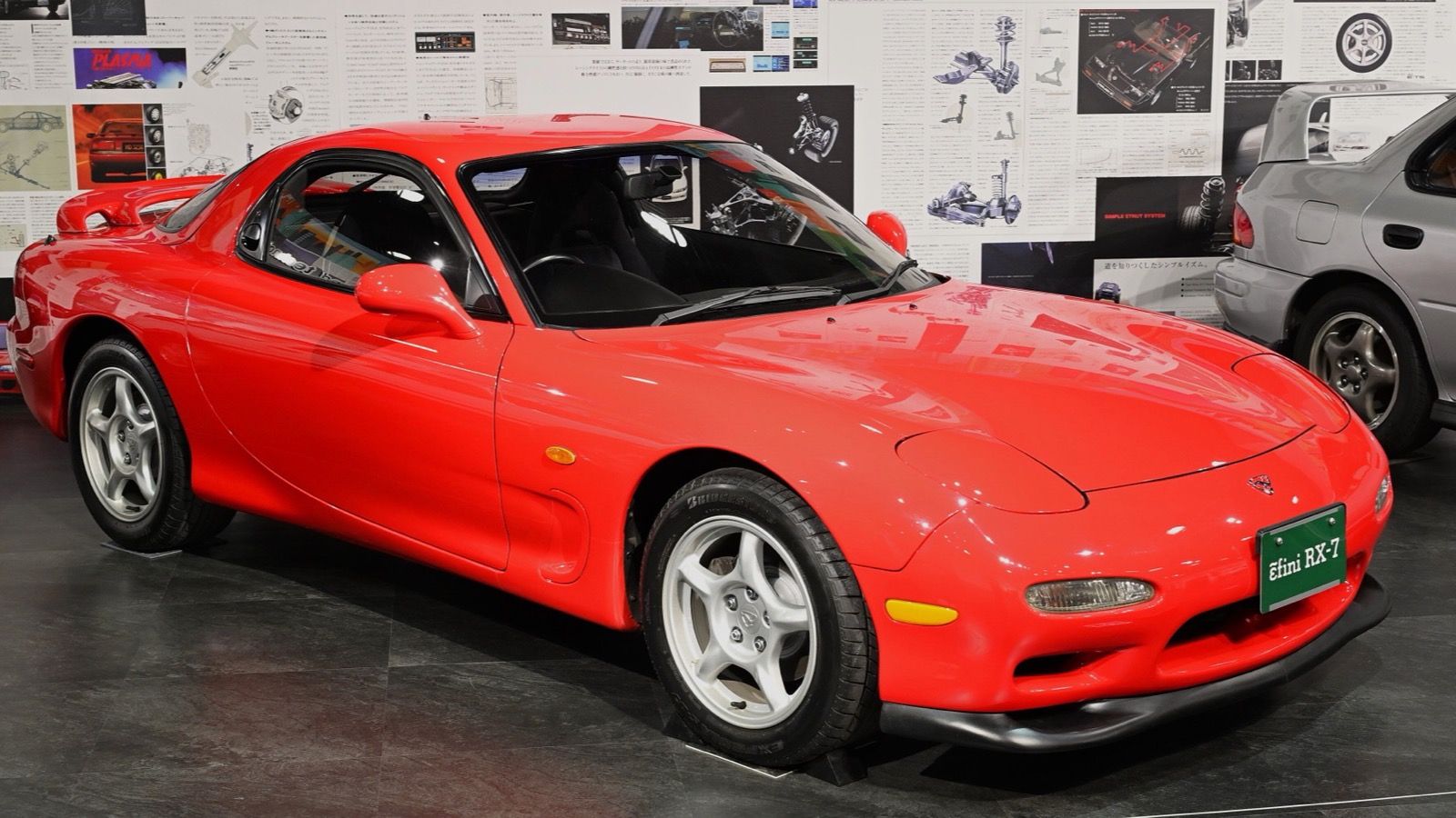 Red 1991 ɛ̃fini RX-7 (FD3S) Series 1, front three-quarter view on museum display