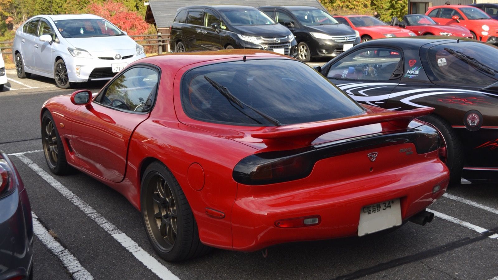 Red ɛ̃fini RX-7 Type R Bathurst (E-FD3S), rear three-quarter view with its factory rear wing