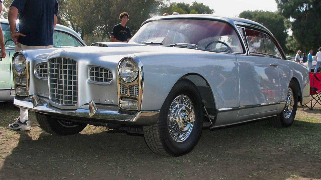 Silver 1956 Facel Vega FV2B hardtop coupé at a car show, front three-quarter view