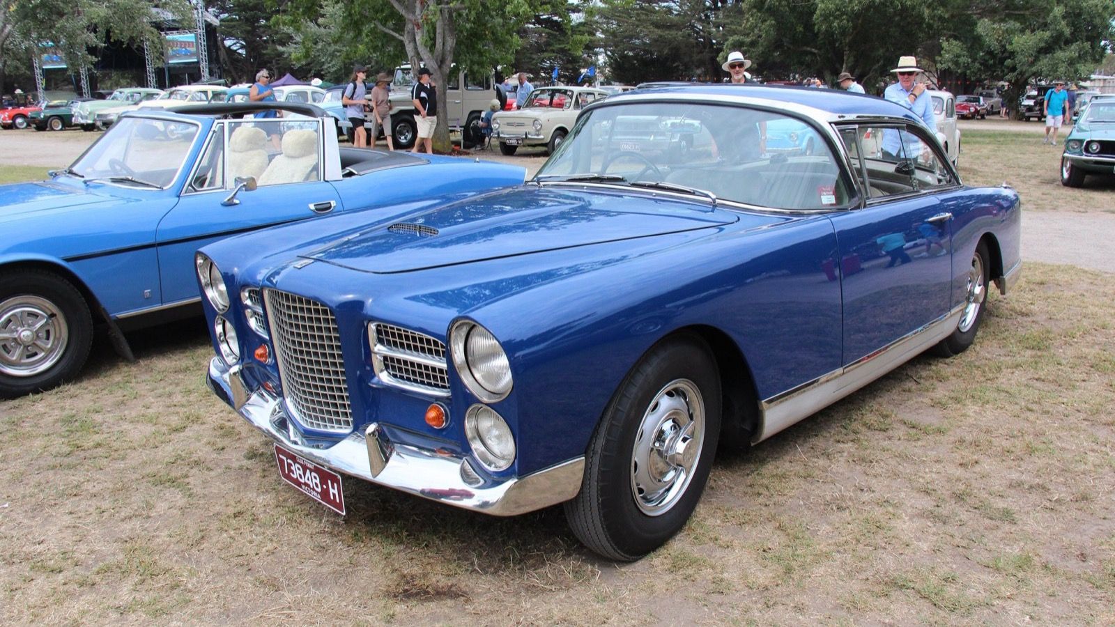 Blue 1959 Facel Vega HK500 coupé at a car show, front three-quarter view