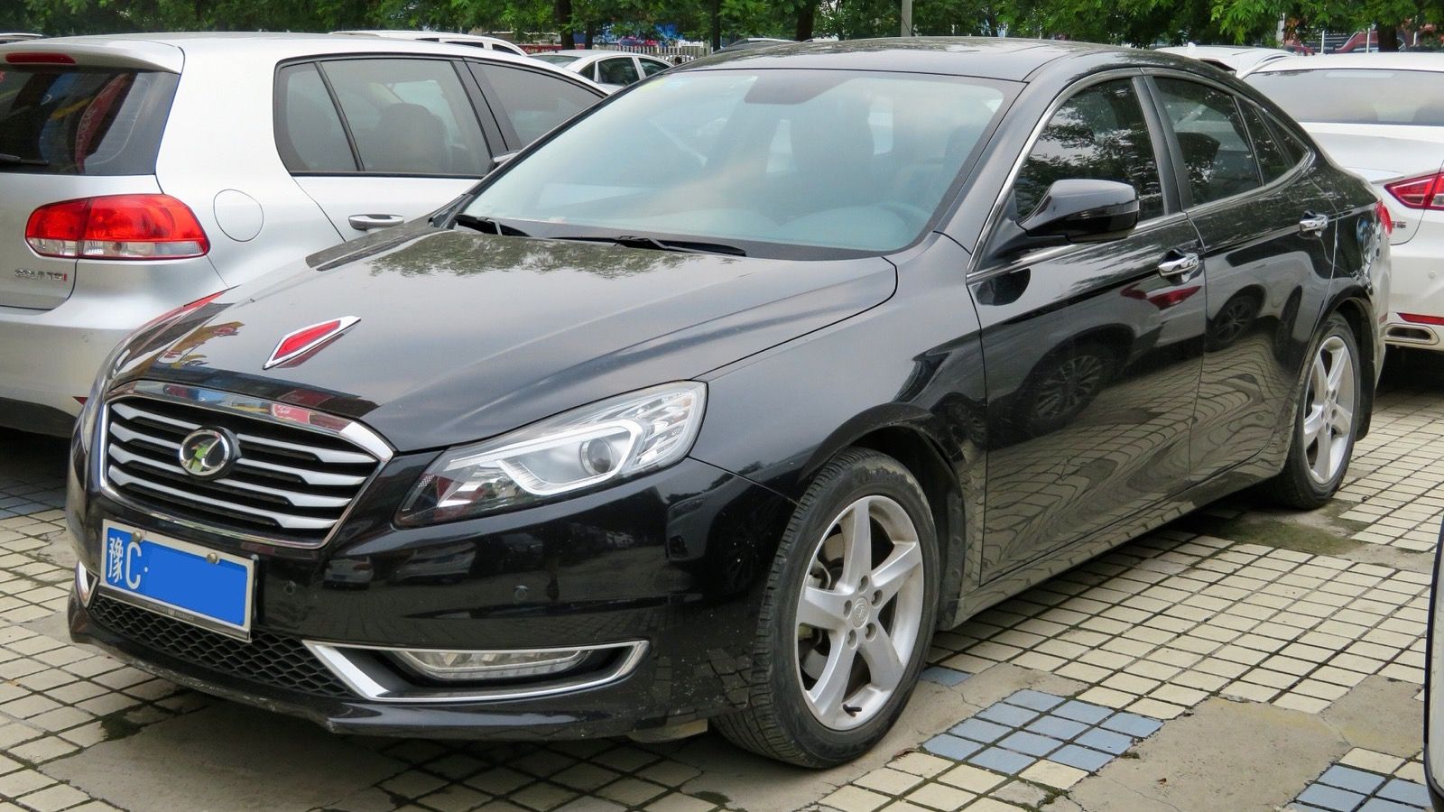 2016 FAW Besturn B70 sedan in black, front three-quarter view