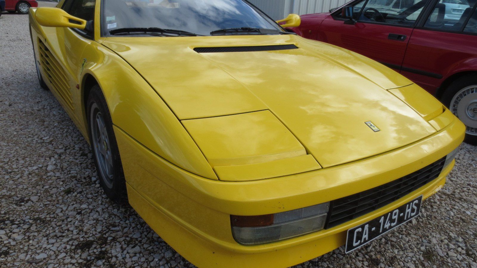 Yellow Ferrari Testarossa, front three-quarter view