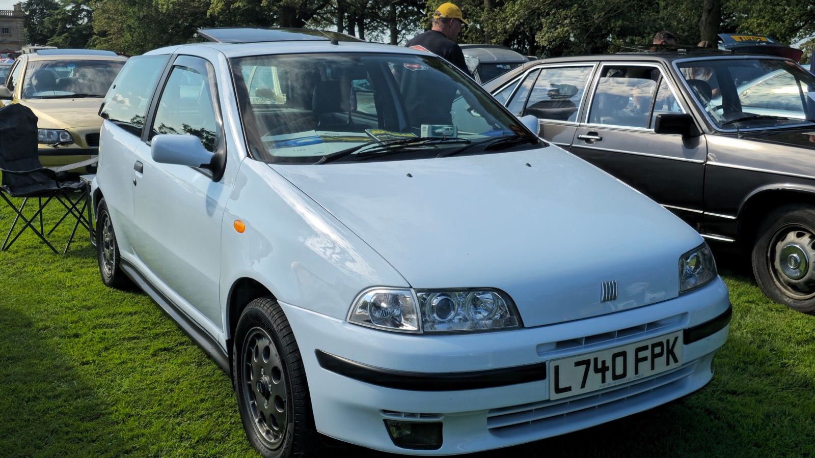 Pale blue first-generation Fiat Punto three-door, front three-quarter view
