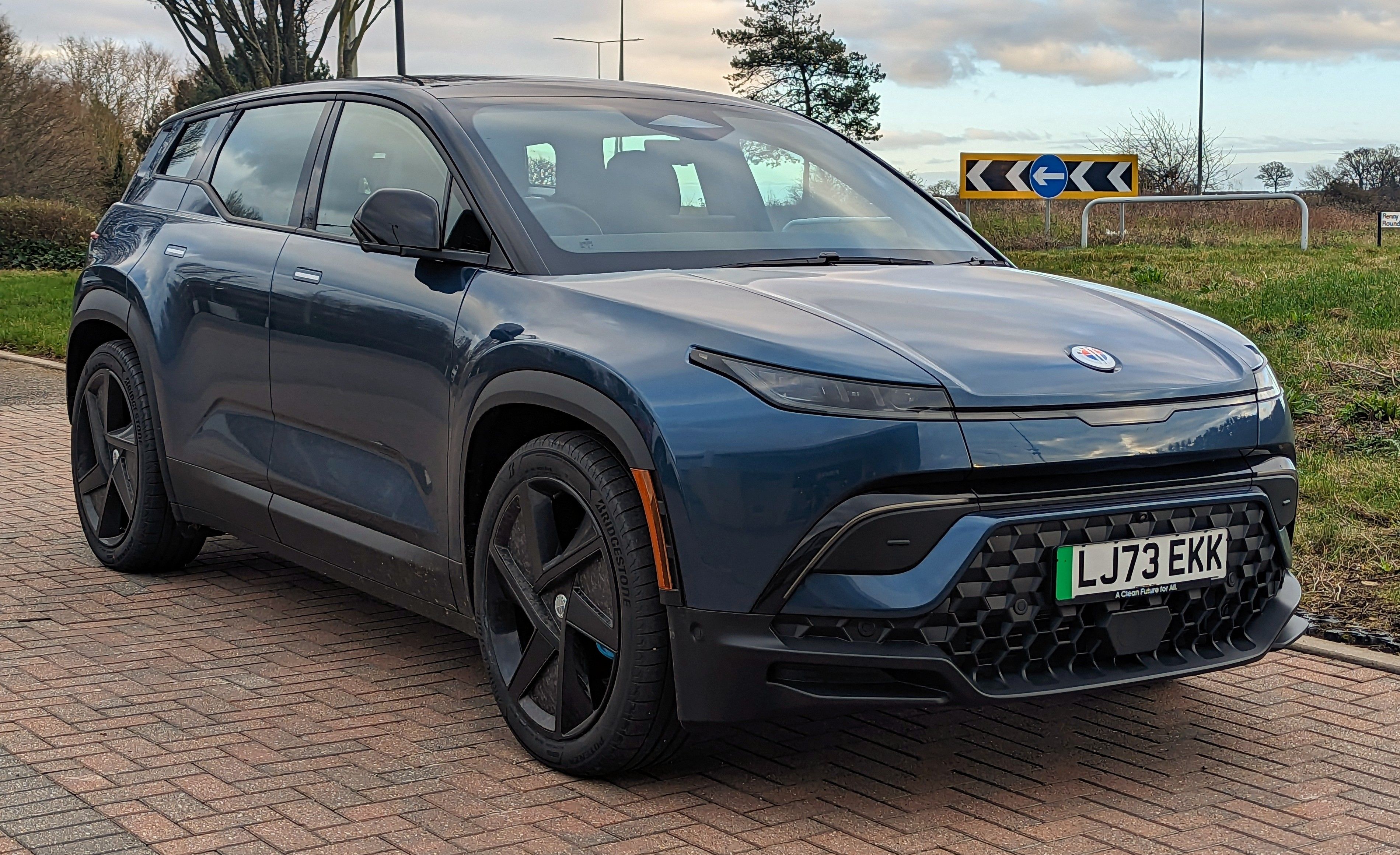 Dark blue Fisker Ocean electric SUV, front three-quarter view